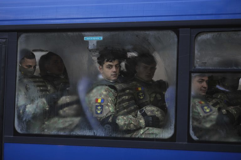 Romania’s president decorates medics, teachers in scaled-back national day celebrations