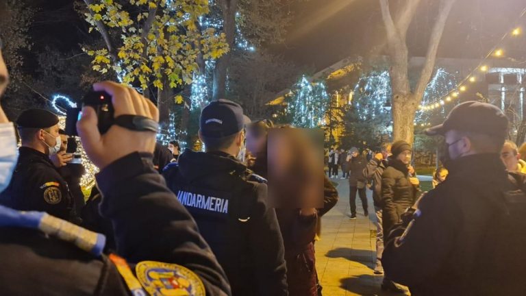 Unvaccinated people and riot police scuffle at Christmas market in Romania