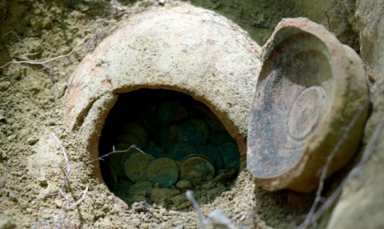 Romanian treasure hunter discovers a trove of 300 Roman coins in forest