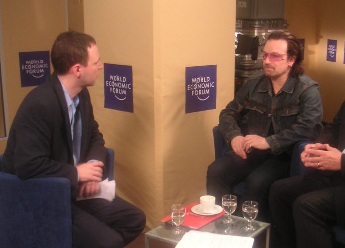 Author Dan Perry with Bono of U2 at Davos.