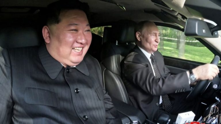 Putin and Kim, hand in hand