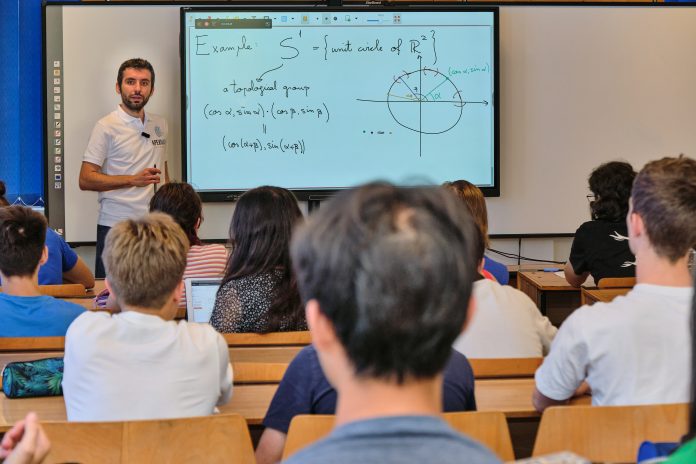 Andrei Negut teaches a class of top young mathematicians at the APEX Mathematics (Academic Program of Excellence) summer camp.