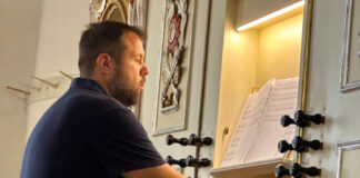 Organist Bruno Roth in Saschiz church. Photo: Larry Luxner
