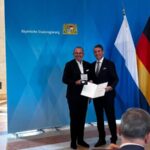 Michael Schmidt receives medal for Special Merits from the state of Bavaria. Photo: Facebook