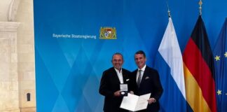 Michael Schmidt receives medal for Special Merits from the state of Bavaria. Photo: Facebook