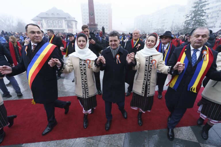 PHOTOS | ‘You won the right to protest’ says Romanian president as he’s booed on day to mark dawn of the modern-day state