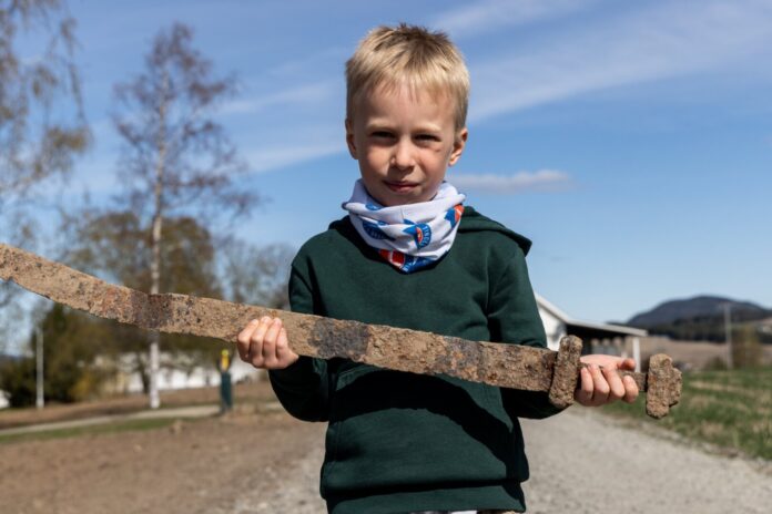 Unsung hero, six-year-old Henrik, unearths a Viking sword on his school trip